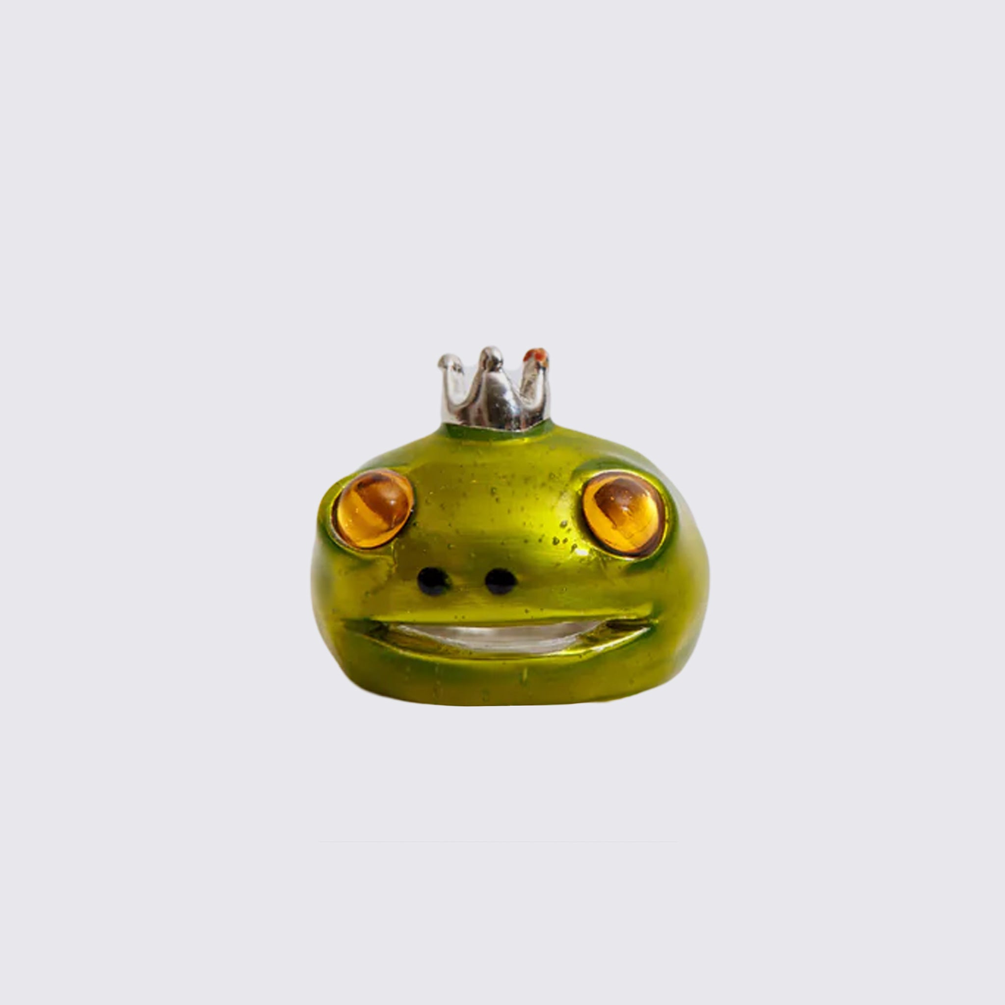 The Frog Prince Ring, a recycled pewter ring shaped like a frog's head wearing a tiny silver crown, hand painted in lime metallic green with golden glass eyes.