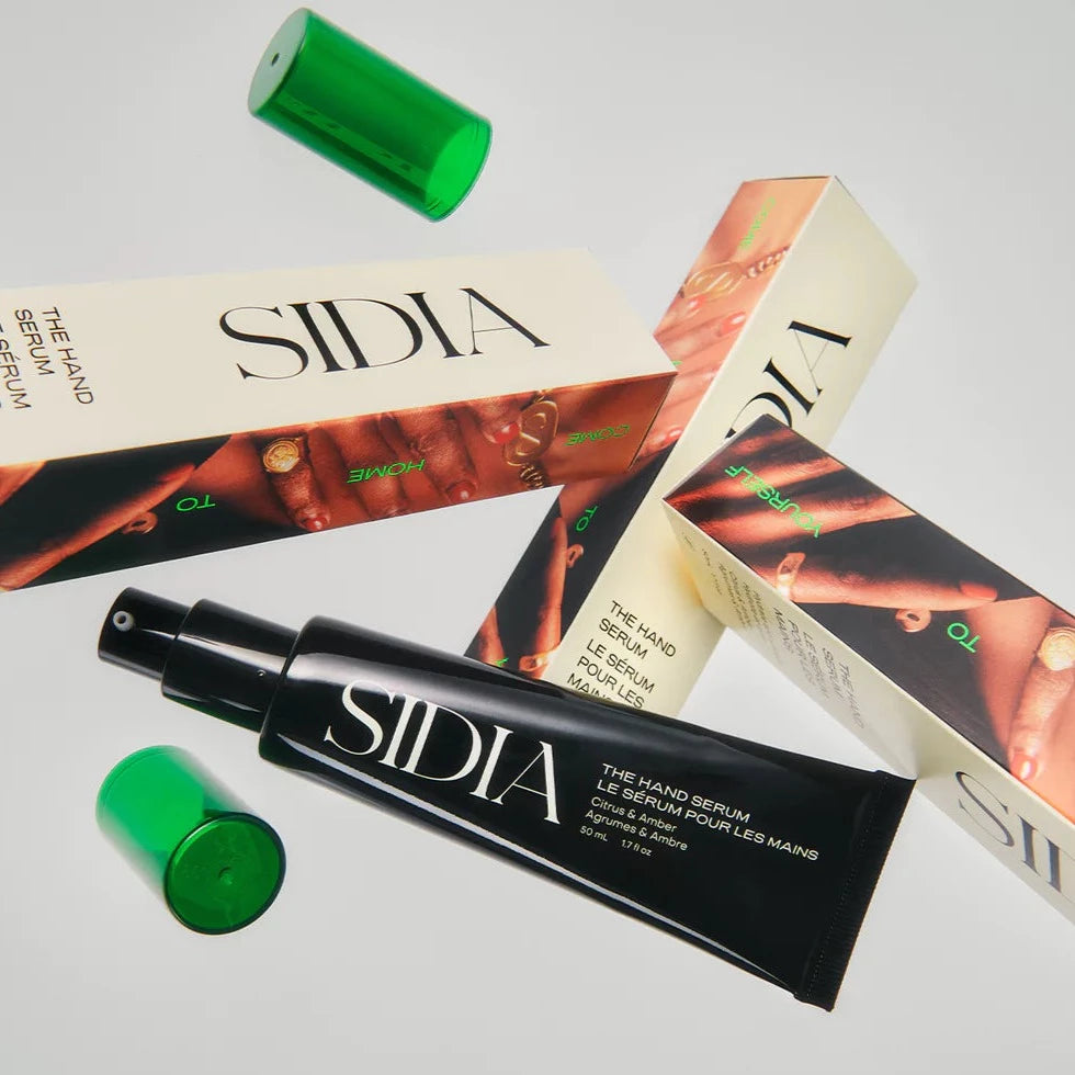 Photo of multiple boxes of the Hand Serum being tossed in the air. 