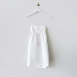 Close flat hanging photo  of the Lace-Back Jacquard Mini Dress - White.