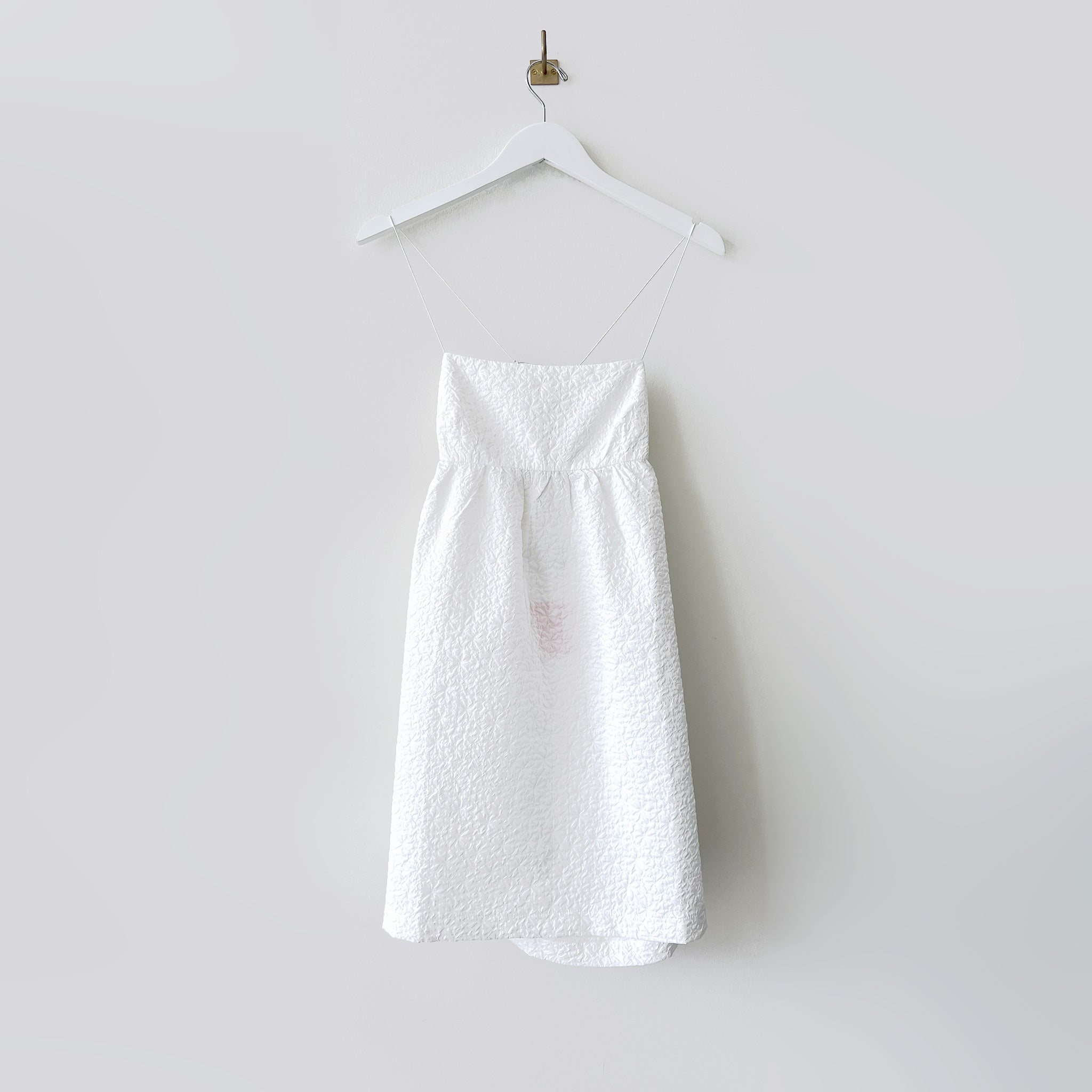 Close flat hanging photo  of the Lace-Back Jacquard Mini Dress - White.