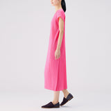 Side detail photo of model wearing the Monthly Colors July S/S Dress - Bright Pink.