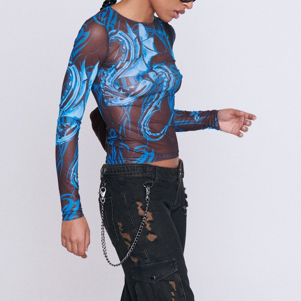 Close side half body photo of model wearing the Long Sleeve Mesh Tee - Tattoo Blue.