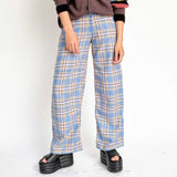 A model wears the wide-leg Lawn checked pant in a blue sky plaid - front view.