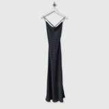 Cowl neck slip dress in black with tiny white dots, front view.