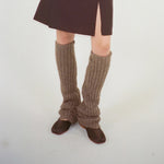 Front photo of model wearing the Luxy Leg Warmer - Brown.