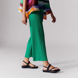 Close half body photo of model wearing the May - Monthly Colors Pant - Green.