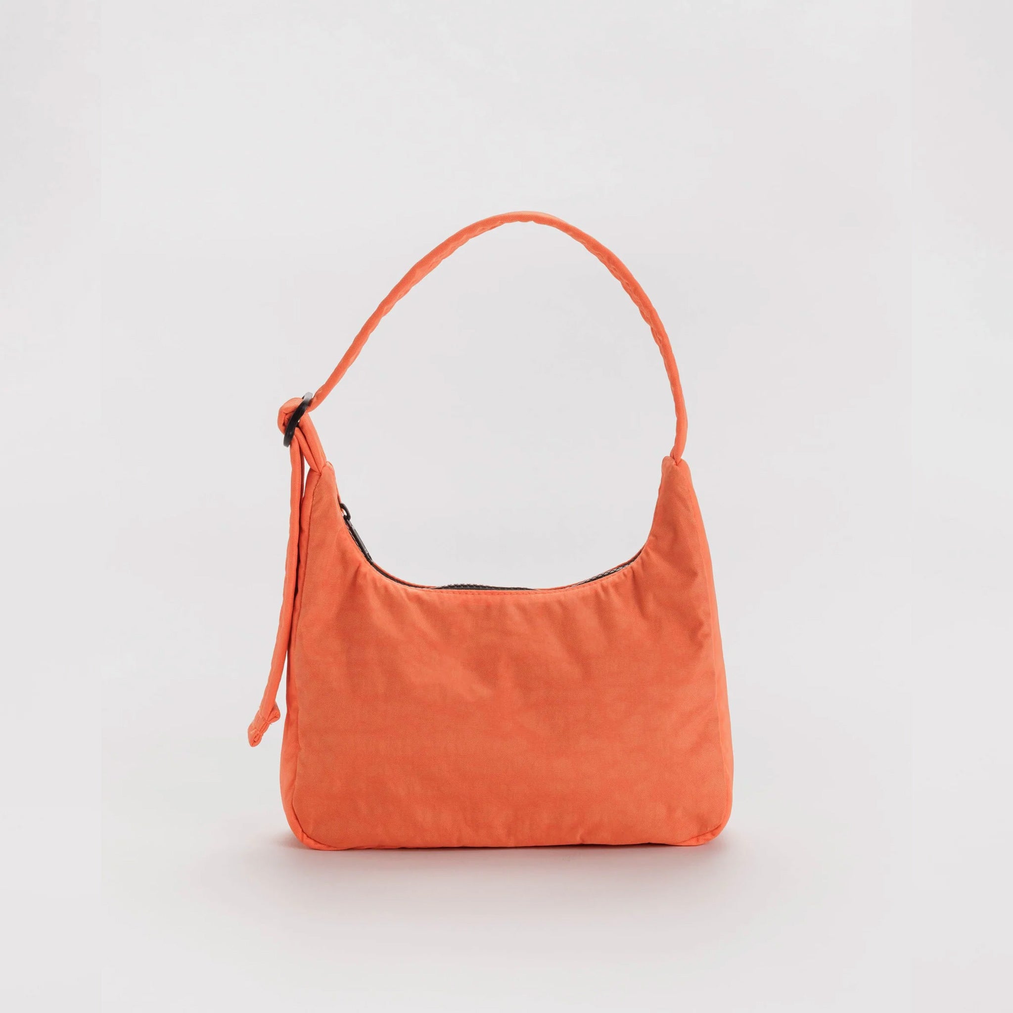 Small nylon shoulder bag in a cheerful bright orange colorway with black zipper and adjustable shoulder strap.