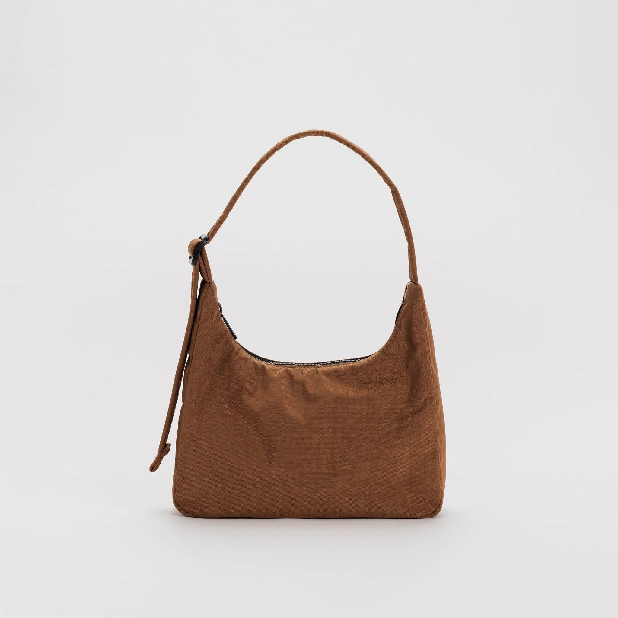 A brown nylon shoulder bag with a rectangular shape and top zipper, shown standing up.