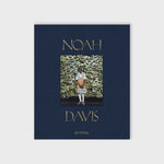 Navy blue cloth-bound cover for Noah Davis: In Detail featuring a painting by American artist Noah Davis.