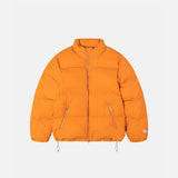 A flat image of the Nylon Down Puffer, a classic puffer jacket with silver zipper hardware and bungie cords at the waist for cinching.
