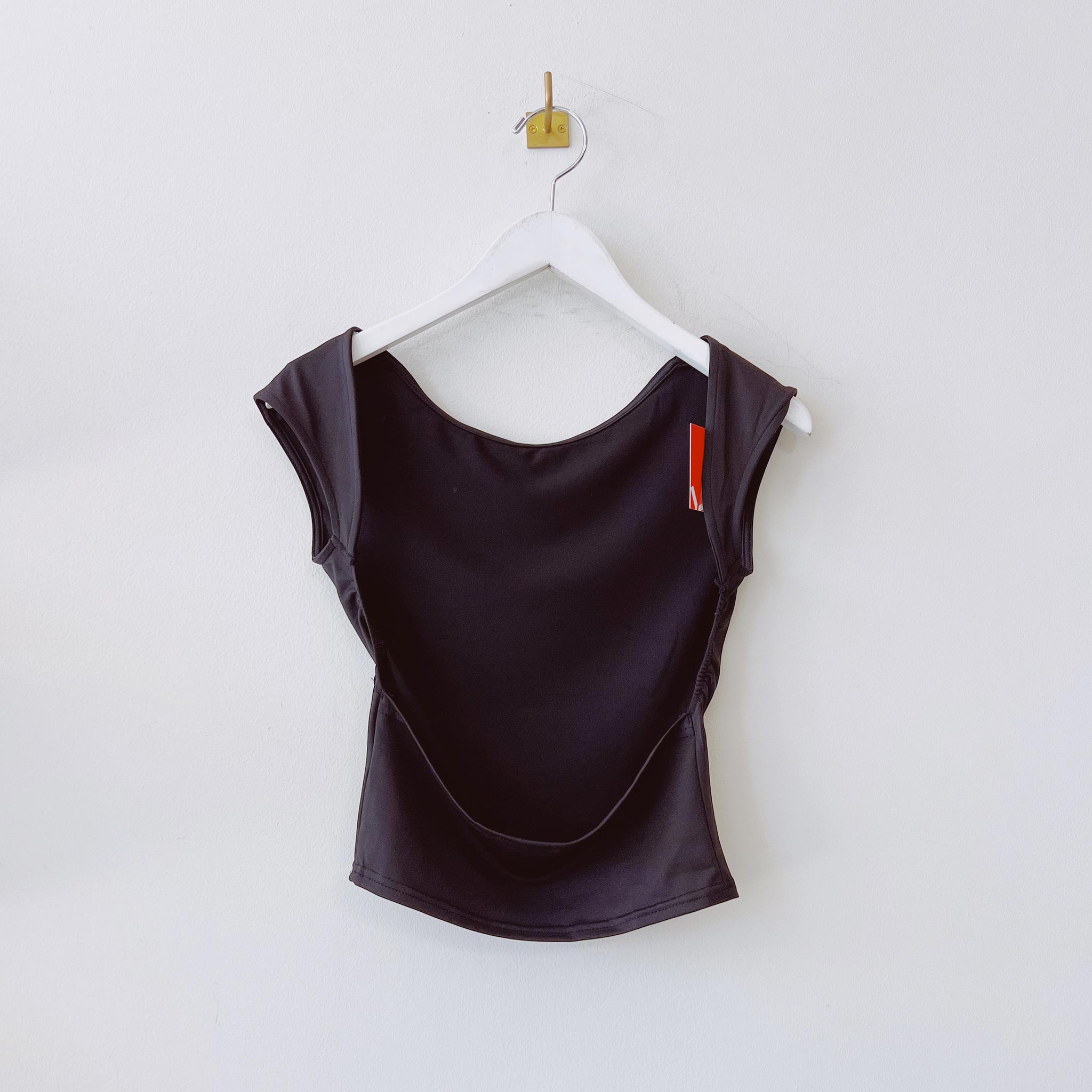 Back hanging photo of the Open Back Ballet Tee - Black.