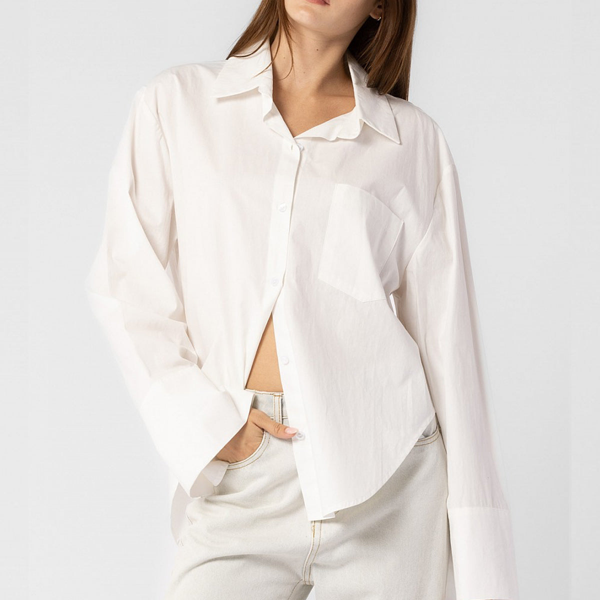 Close half body photo of model wearing the Oversized Button Down Shirt - White.