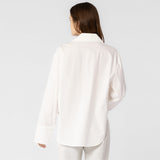 Back half body photo of model wearing the Oversized Button Down Shirt - White.