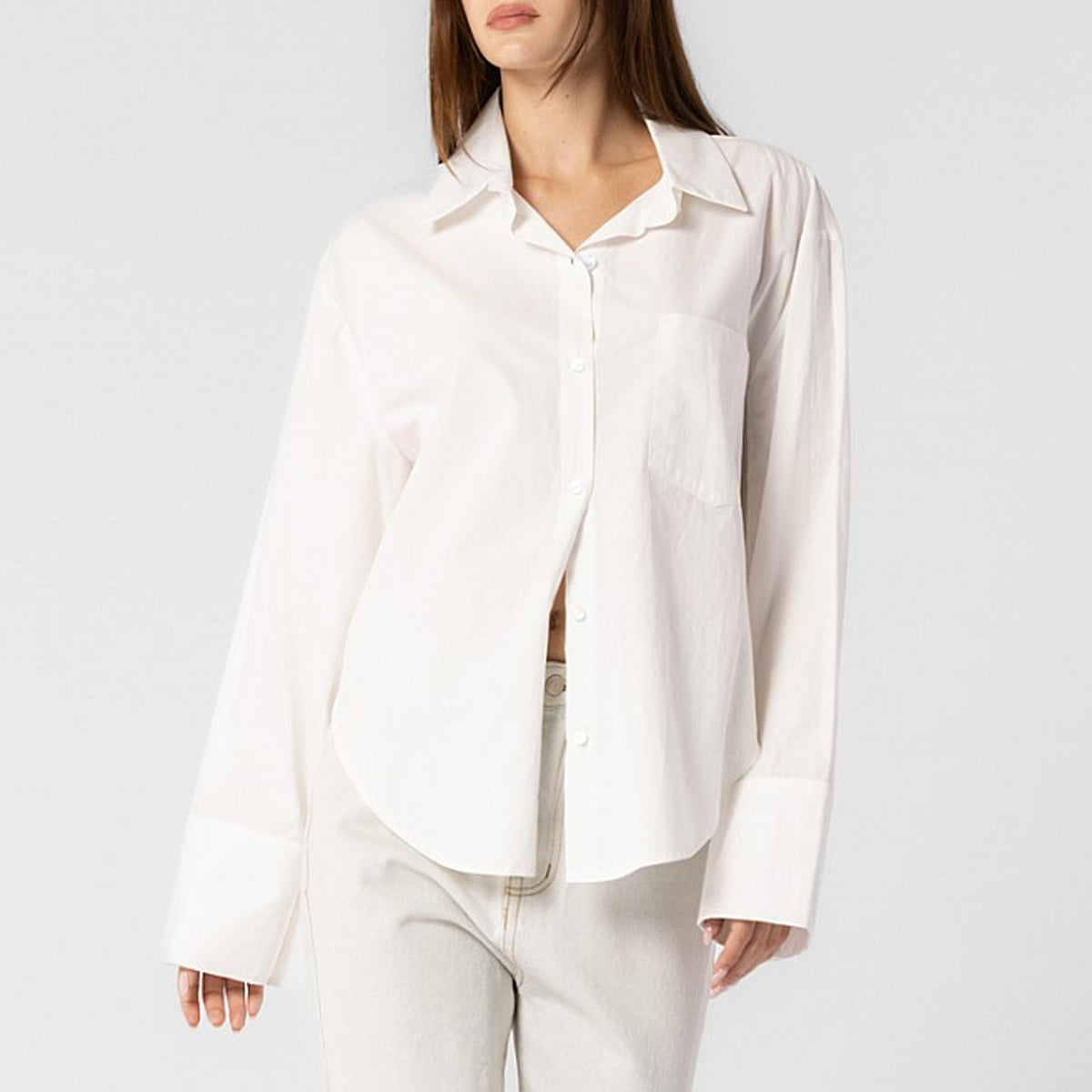 Close half body photo of model wearing the Oversized Button Down Shirt - White.