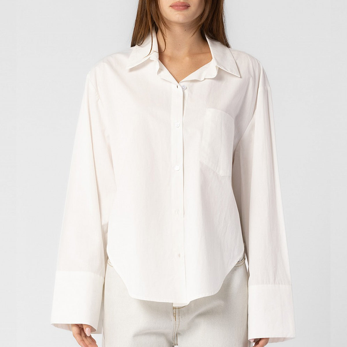 Front half body photo of model wearing the Oversized Button Down Shirt - White. 