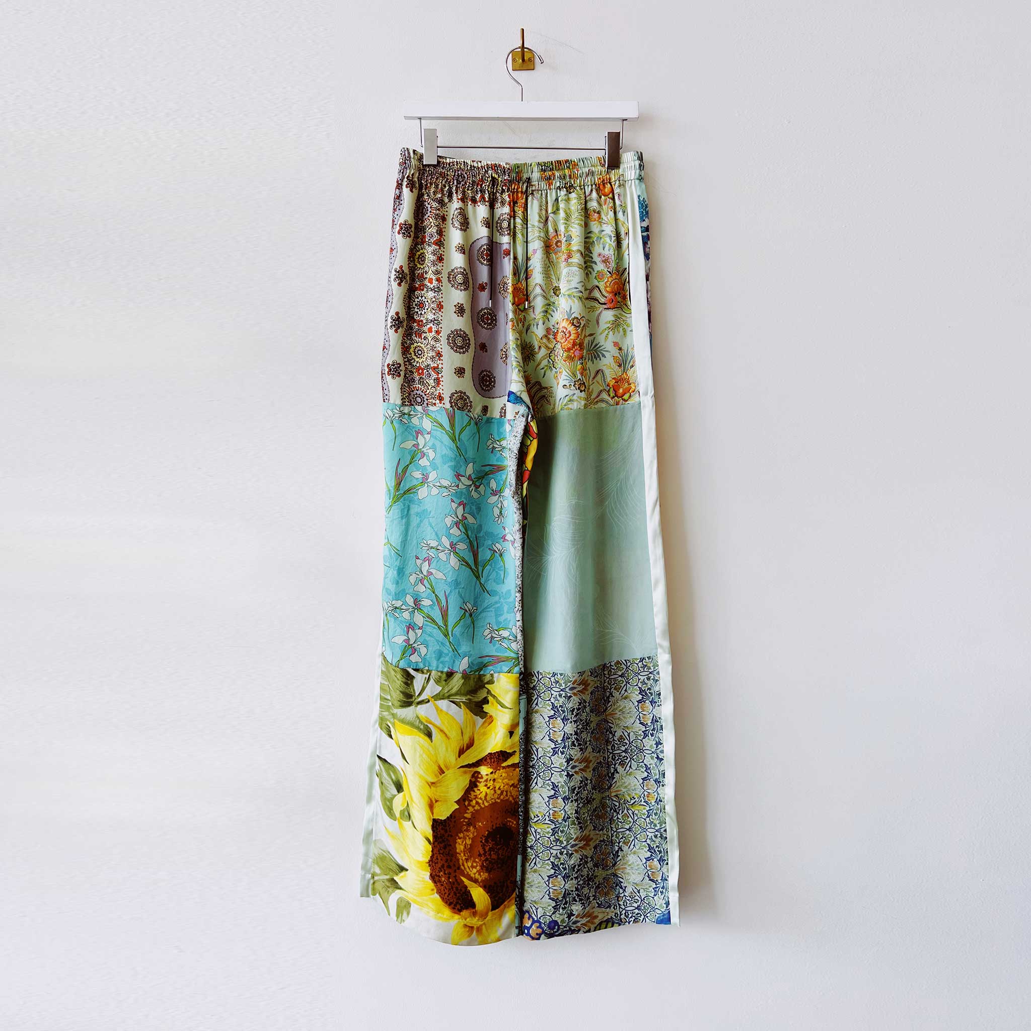 Silk pajama style pants created from multiple vintage scarves and overdyed in a seafoam green tonal color - front of the size Small.