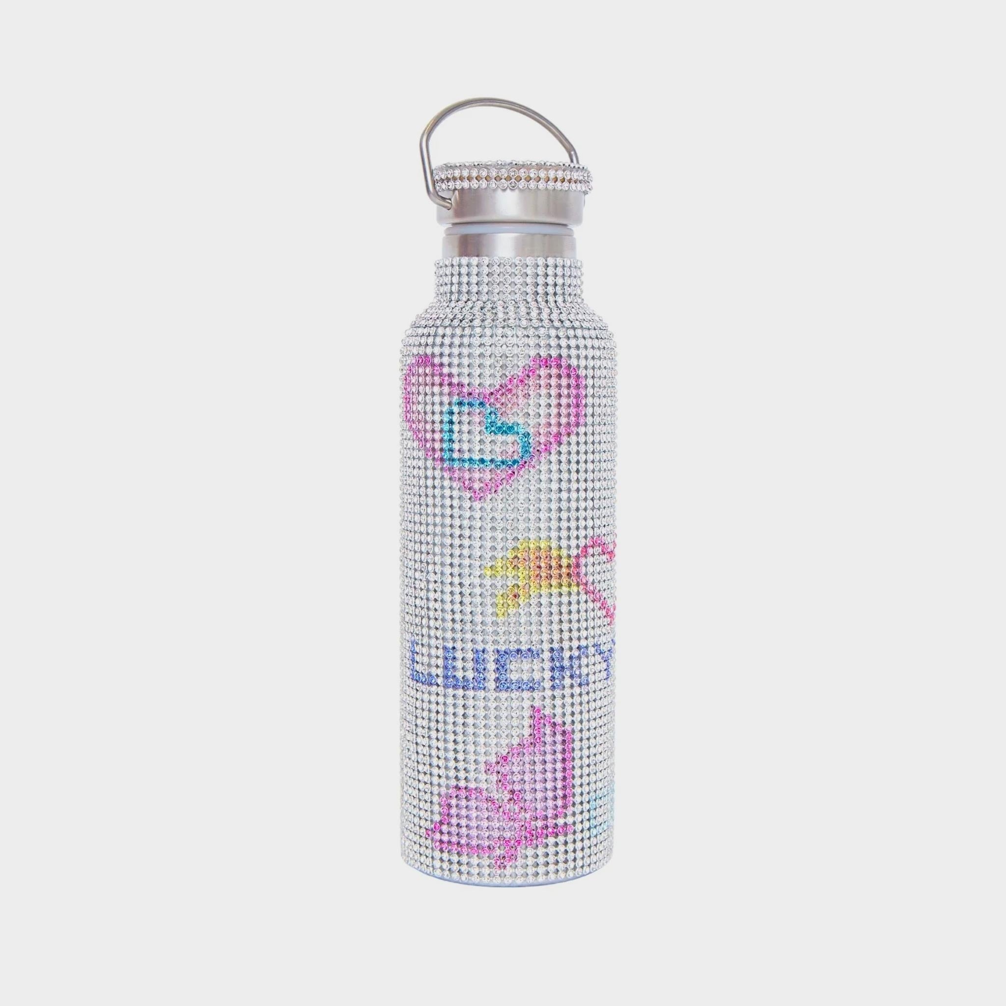 Stainless steel water bottle covered in white rhinestone crystals with a doodled pattern featuring pink hearts and the word Lucky.