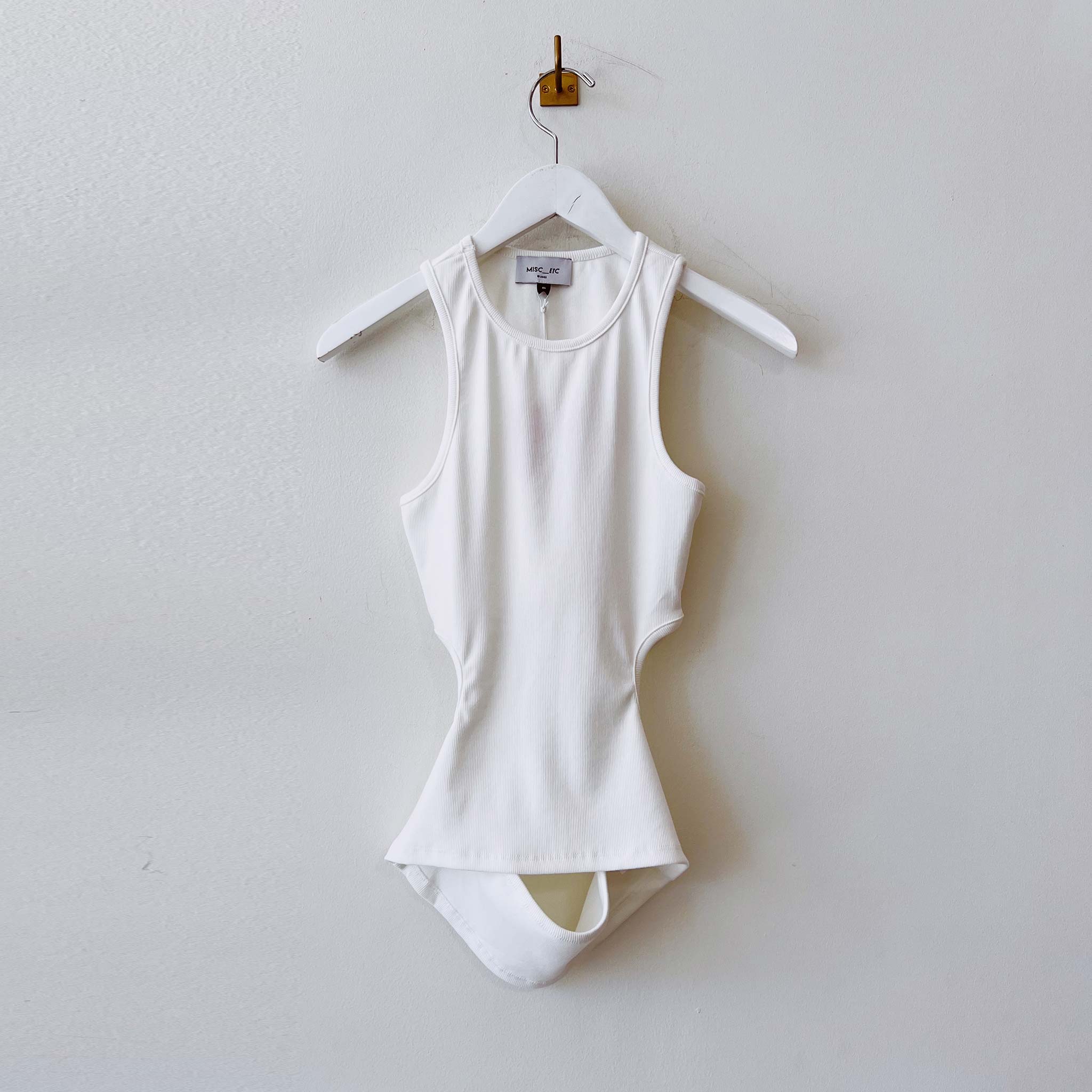 Flat hanging photo of the Ribbed Cut Out Racerback Tank - Cream.