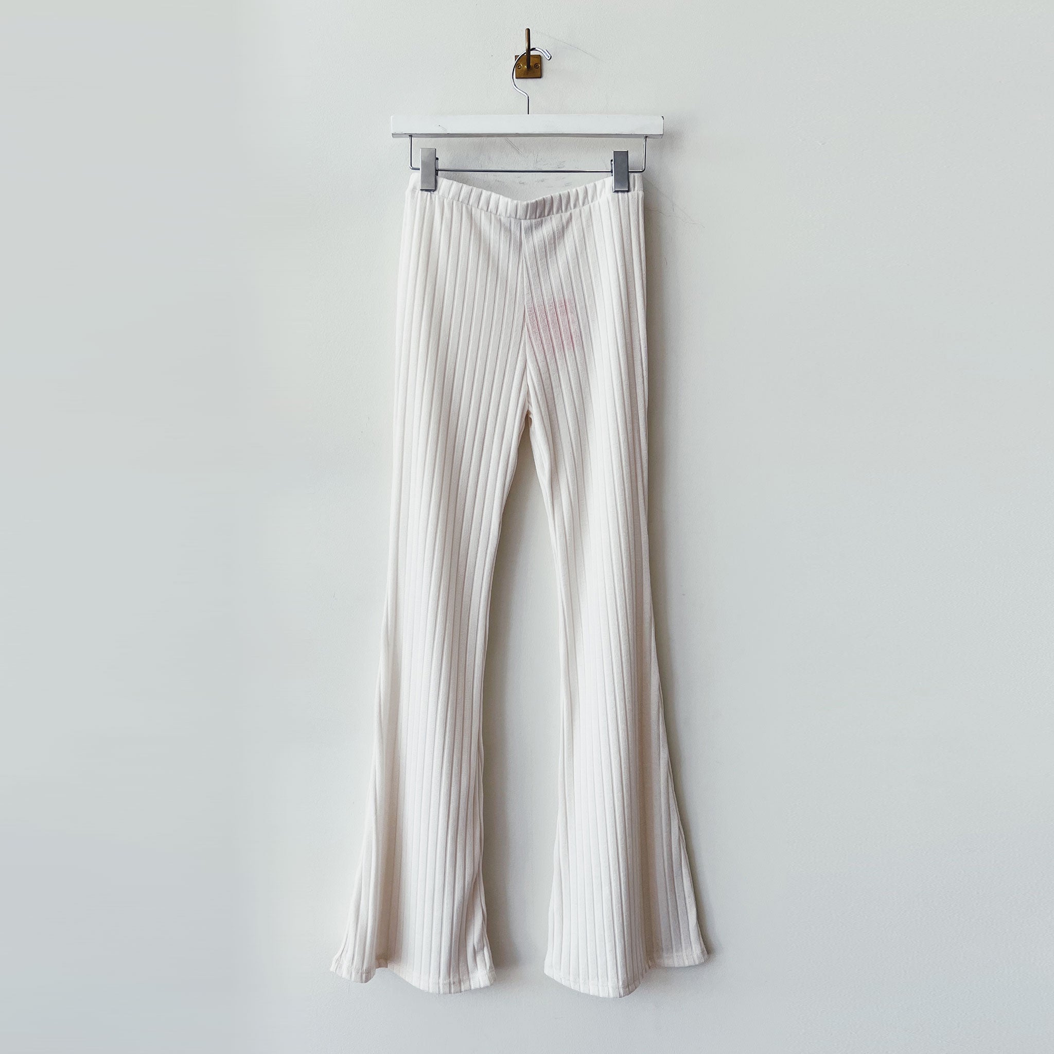 Flat photo of the Ribbed Knit Flared Pants - Ivory.
