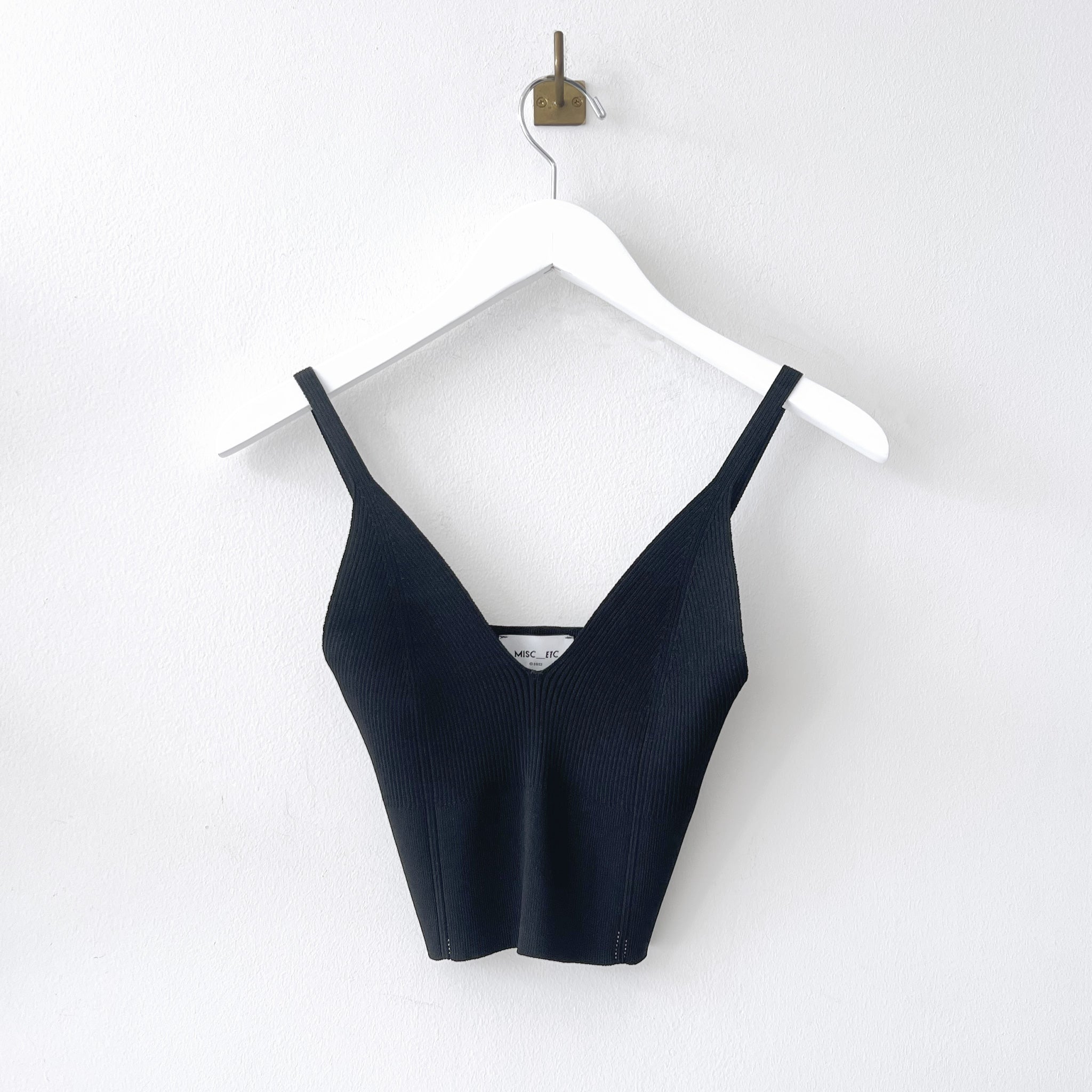 Flat hanging photo of the Ribbed Knit Top - Black.