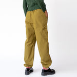 Back view of the olive green Ripstop Cargo Beach Pant by Stussy, paired with black loafers.