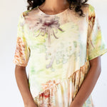 Close up of the Ritual Dress - Light Chrysanthemum, a full length short-sleeved printed dress.