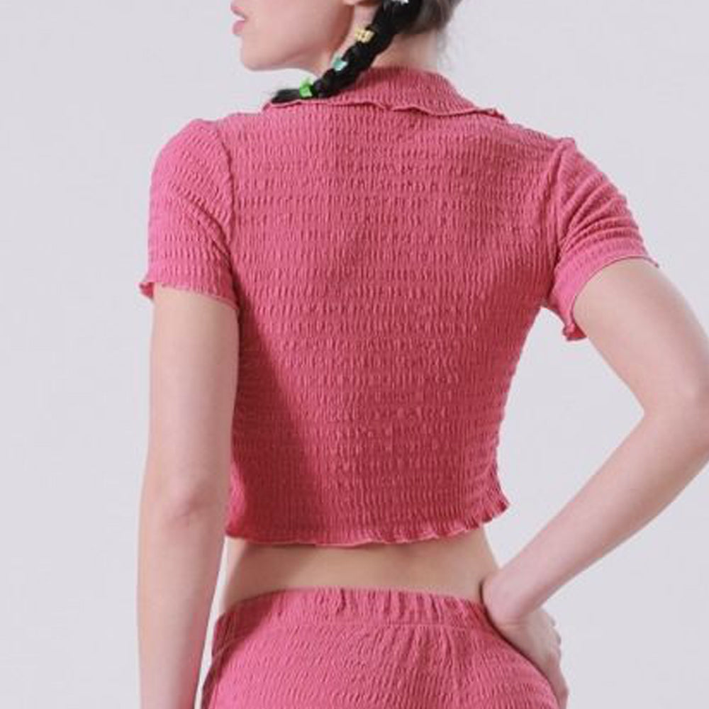 Back half body photo of model wearing the V-Neck Ruched Polo Top - Dark Rose.