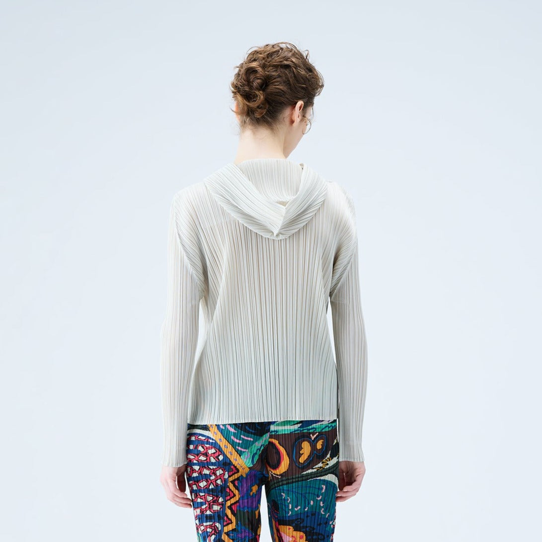 Back half body photo of model wearing the Pleated Hoodie - Greige.