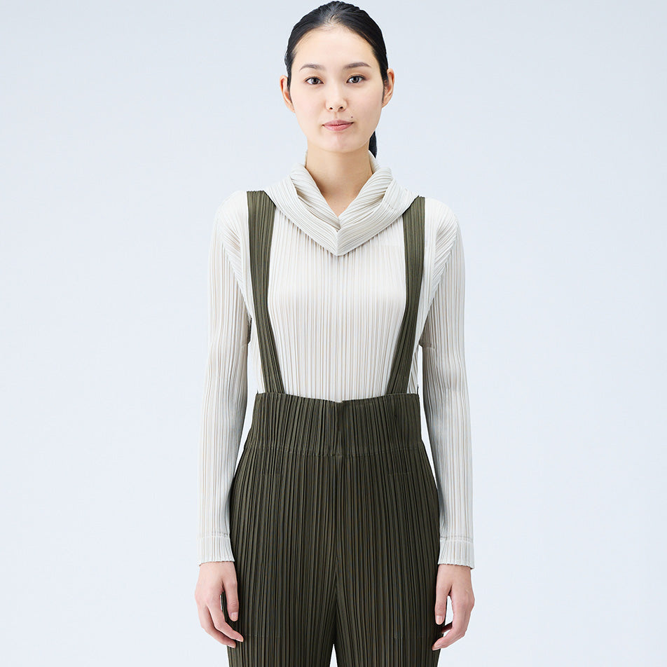 Front half body photo of model wearing the Pleated Hoodie - Greige.