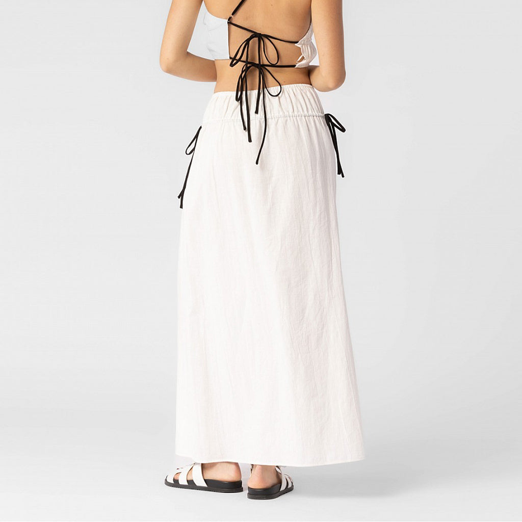 Back half body photo of model wearing the Cotton Side Ribbons Midi Skirt - White.