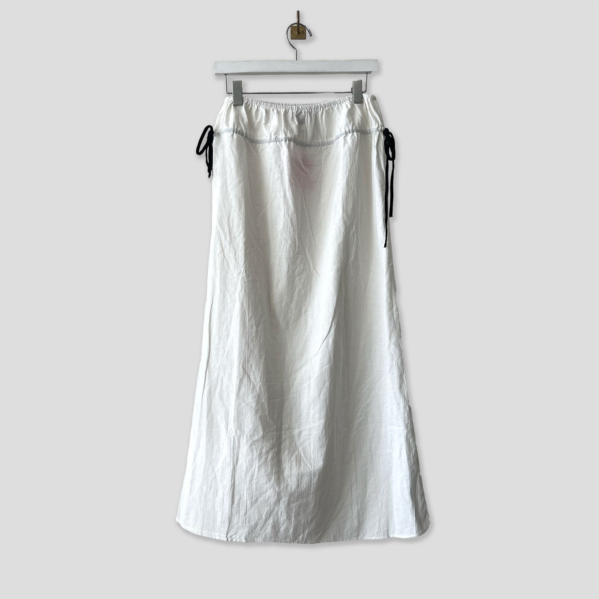 Hanging photo of the Cotton Side Ribbons Midi Skirt - White.