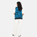 Back full body photo of model wearing the Stacked Sweater Vest - Dark Navy.