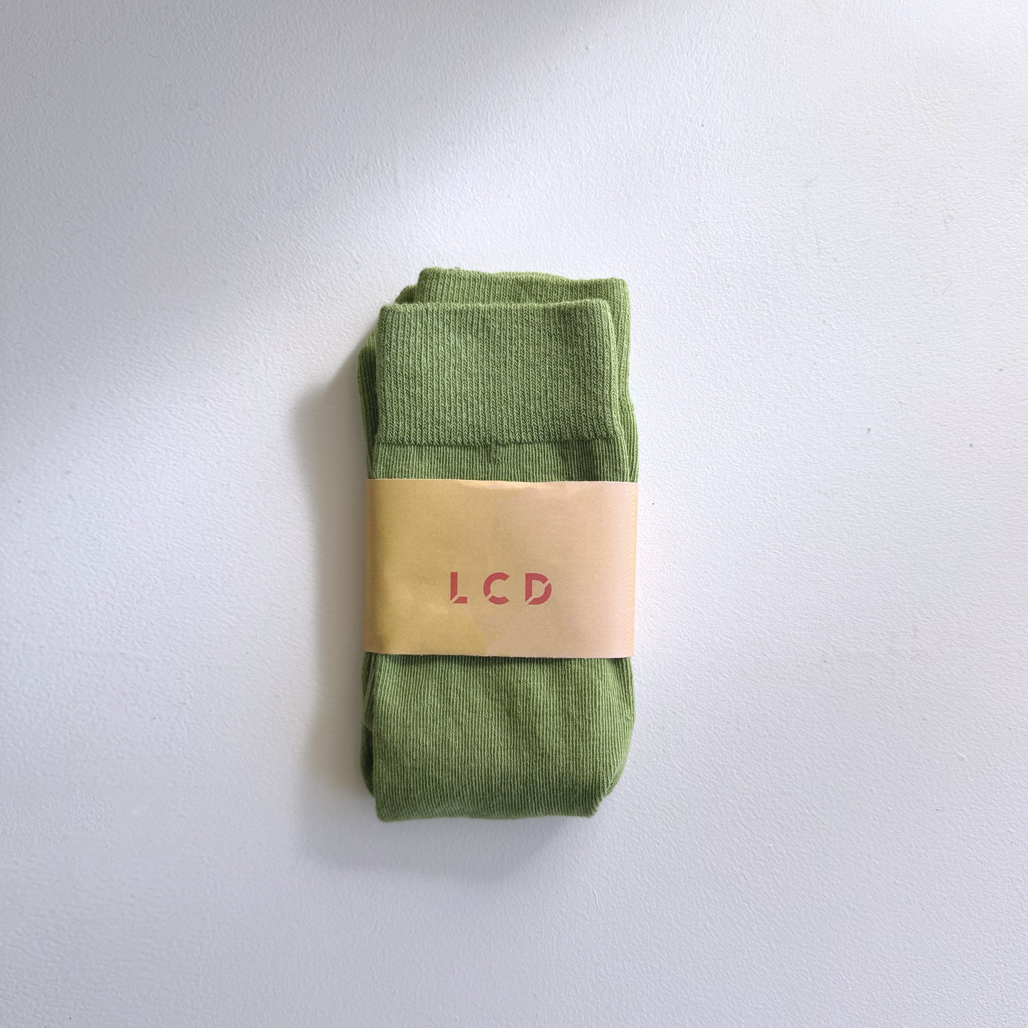 A midweight unisex crew sock in green.