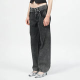 Close side angle detail photo of model wearing the Womens Twisted Seam Jeans - Dark Brown.