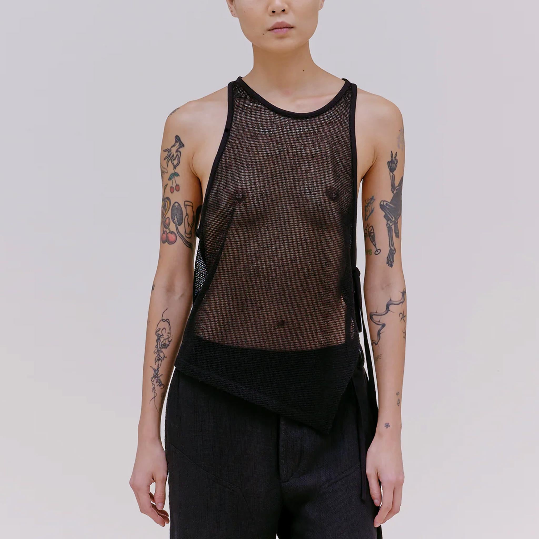 Front half body photo of model wearing the UV tank in the color midnight.
