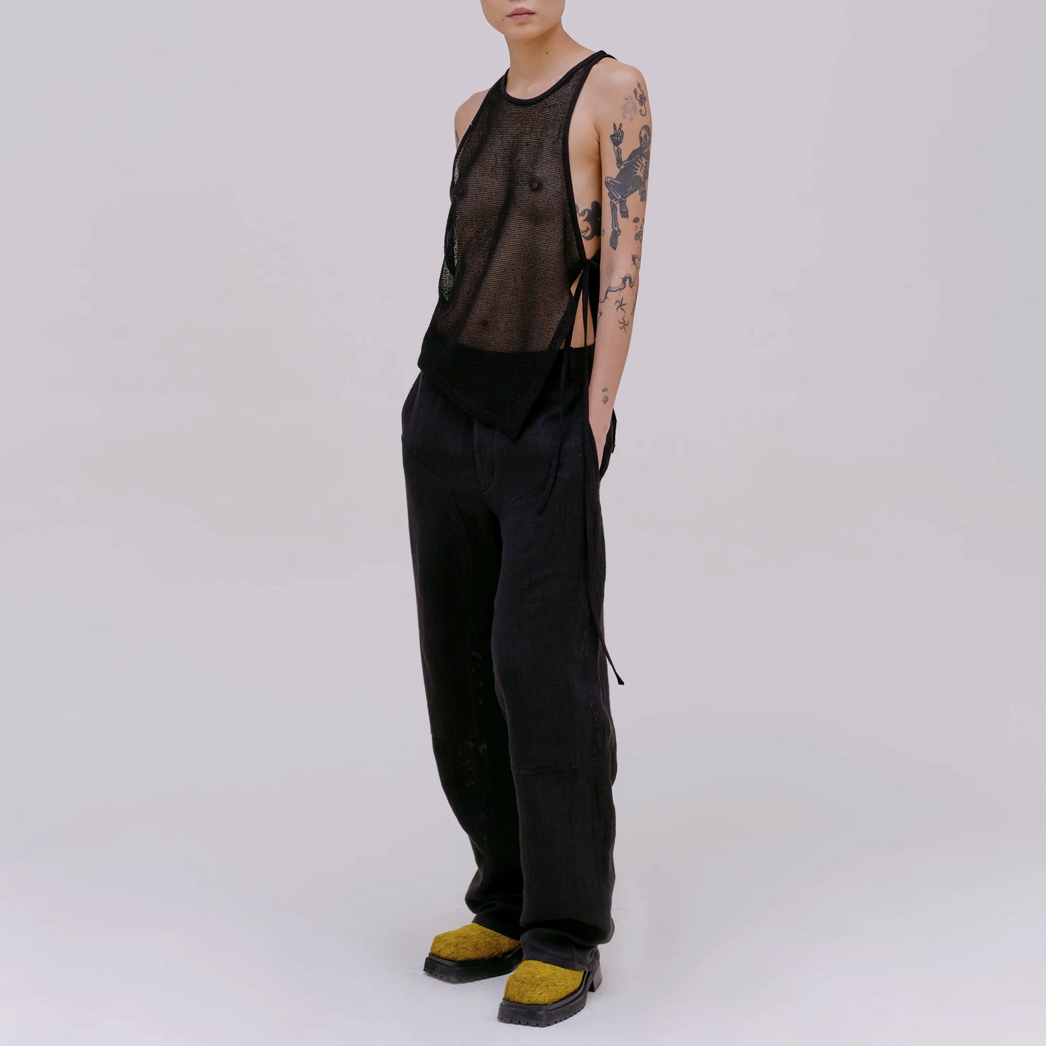 Full body photo of model wearing the mesh UV tank in the color midnight. 