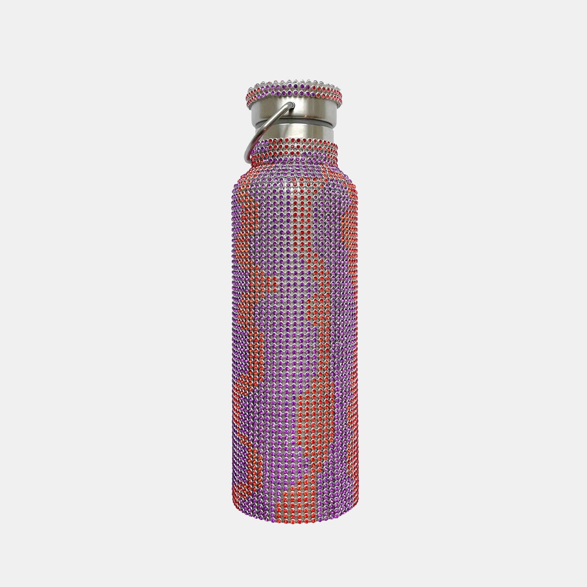 A stainless steel water bottle covered in rhinestones with an orange and purple squiggly line pattern.