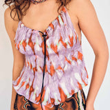 A model wears the lightweight Wendy tank top in the purple Wallace graphic print - detailed view.