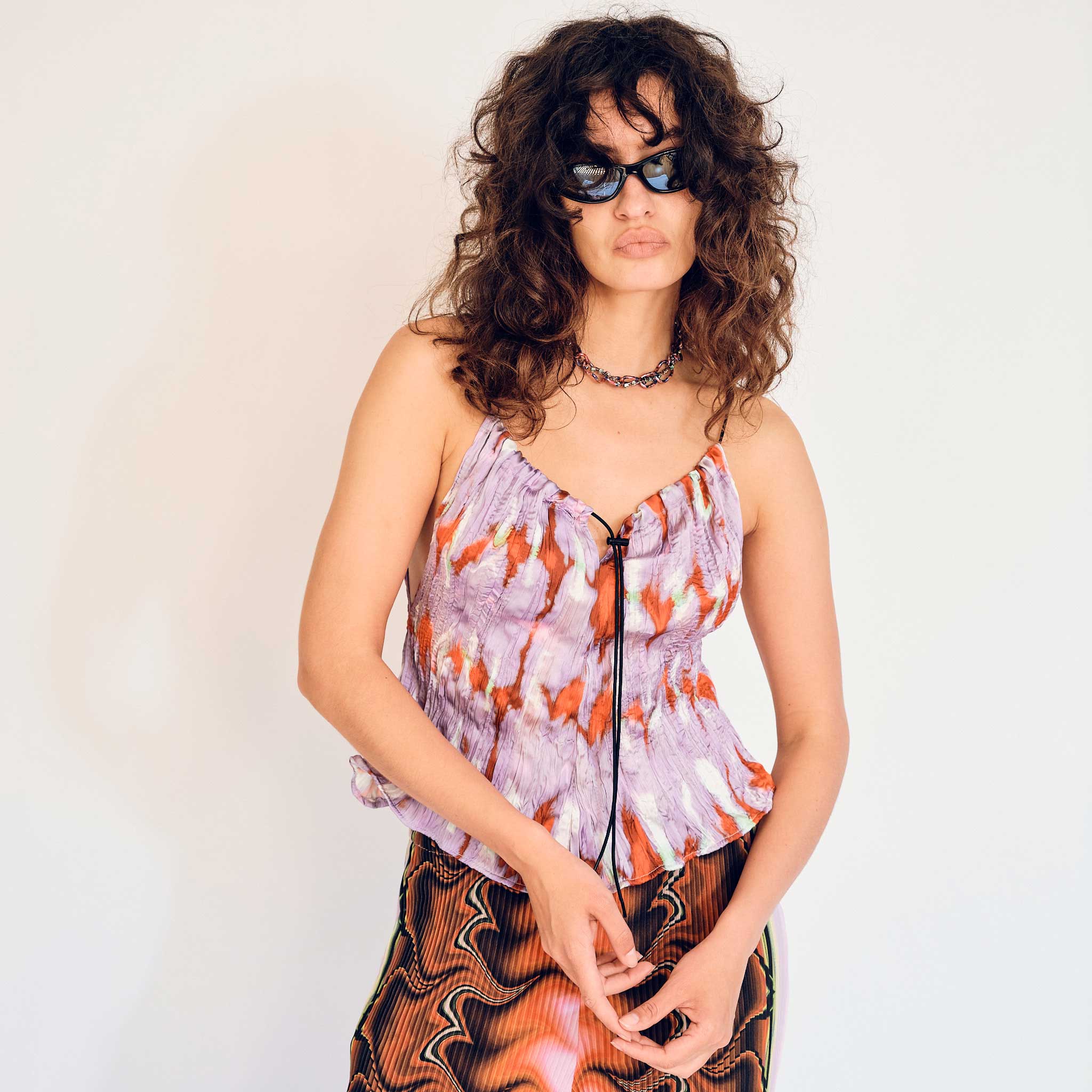 A model wears the lightweight Wendy tank top in the purple Wallace graphic print - front view.