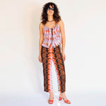 A model wears the lightweight Wendy tank top in the purple Wallace graphic print - full outfit view.