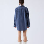 Back half body photo of model wearing the Wide Striped Oversized Shirt - Dark Grey.