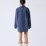 Back half body photo of model wearing the Wide Striped Oversized Shirt - Dark Grey.