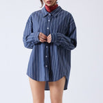 Close half body photo of model wearing the Wide Striped Oversized Shirt - Dark Grey.