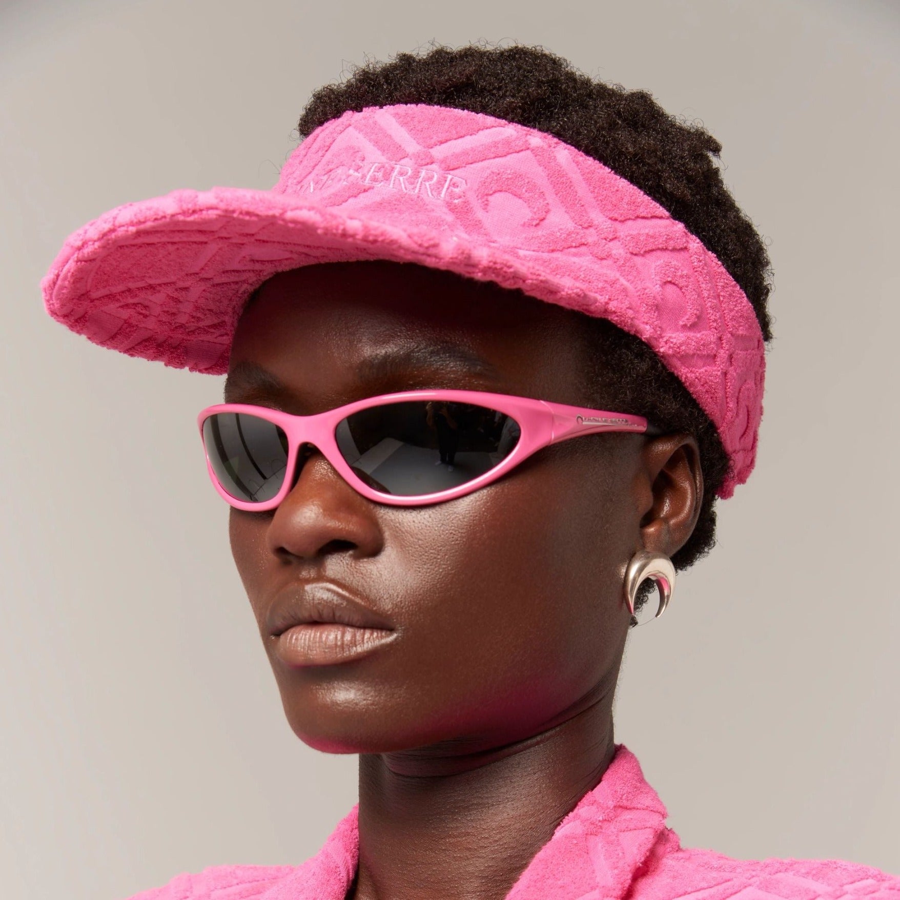 Photo of model wearing the MS x Vaurnet Injected Visionizer Glasses - Pink.