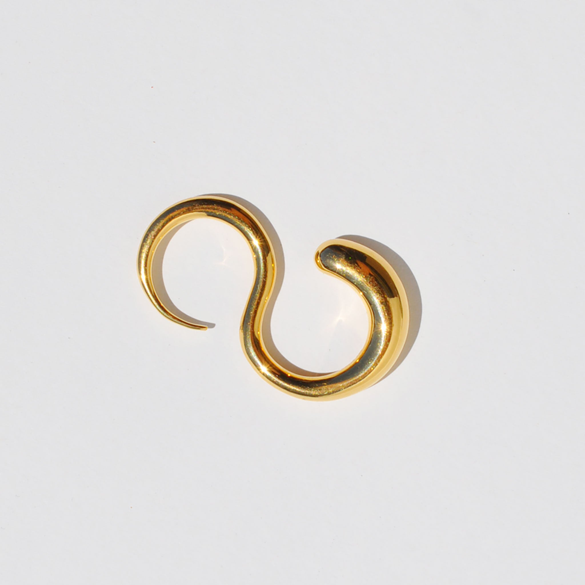Two-finger gold ring in the shape of a coiled snake.