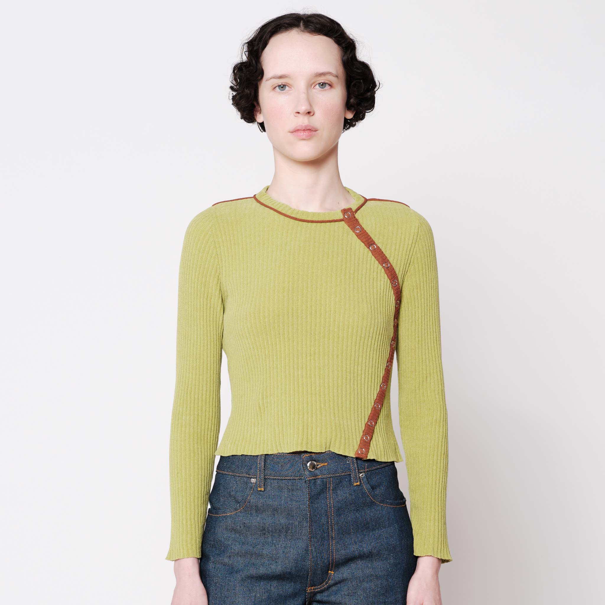 Close half body photo of model wearing the Angle Cardigan - Lime.