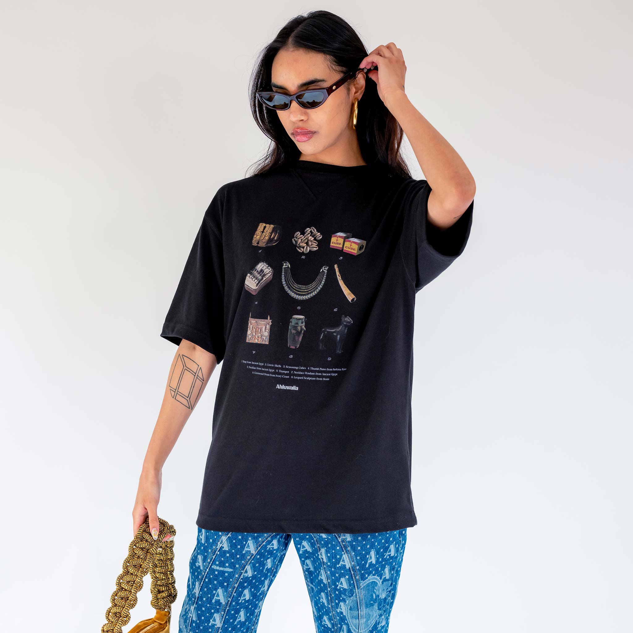 Front half body photo of model wearing the Artefact Tee - Black.