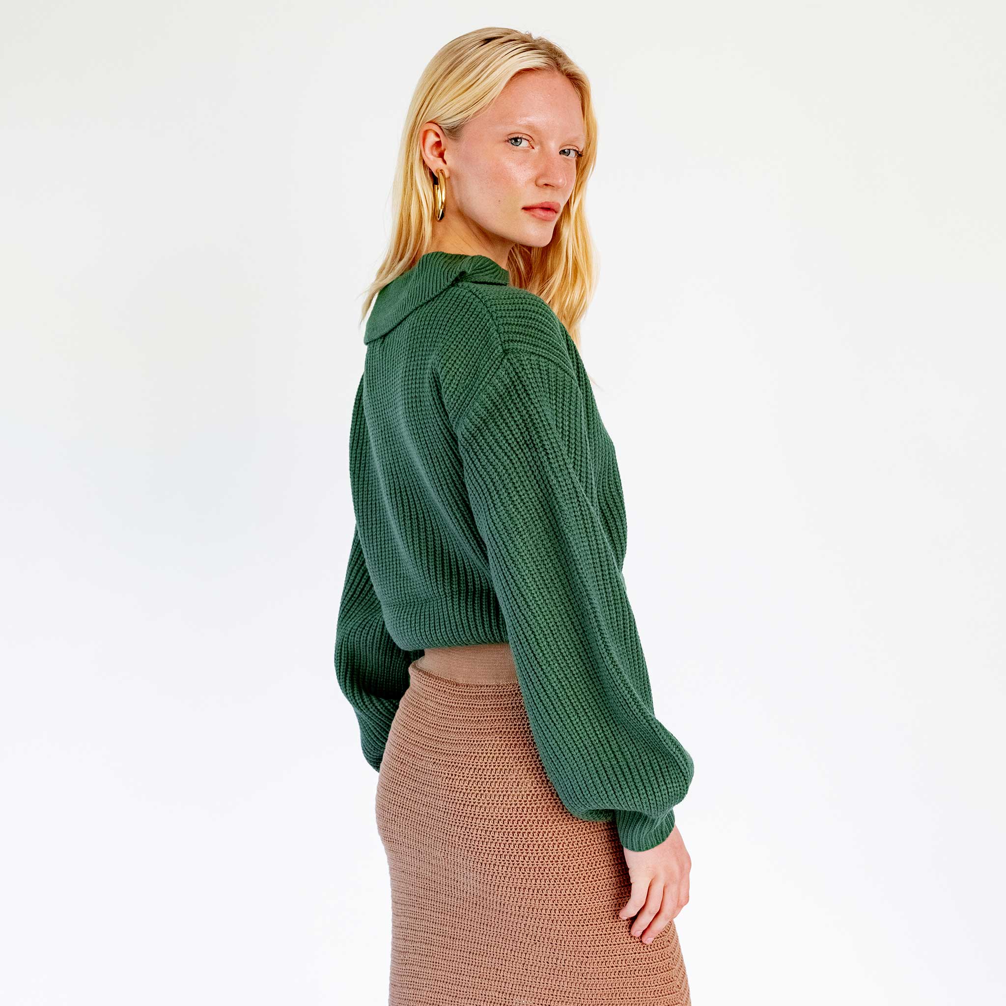 Back half body photo of model wearing the Balloon Sleeve V-Neck Sweater - Green.