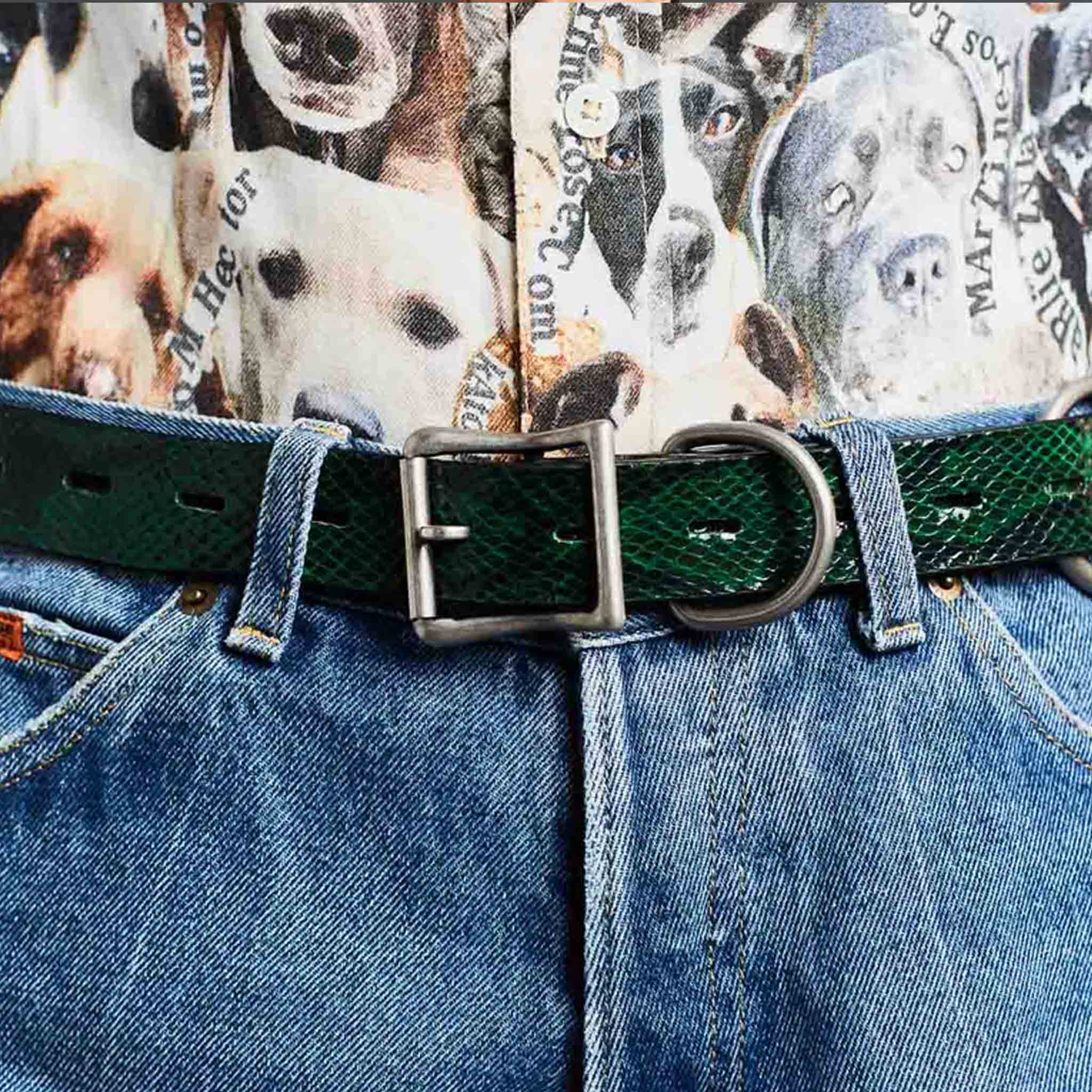 A model wears the green faux snake embossed Bondage Belt by Martine Rose - detail view.