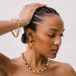 Close detail photo of model wearing the Cable Bracelet.